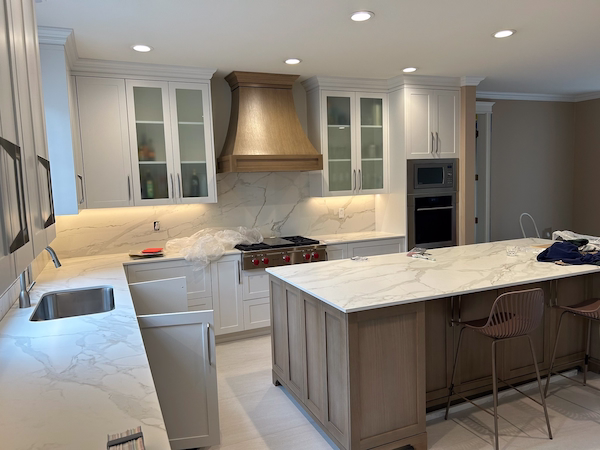 modern-kitchen-with-quartz-countertops-and-wood-hood modern-kitchen-with-quartz-countertops-and-wood-hood